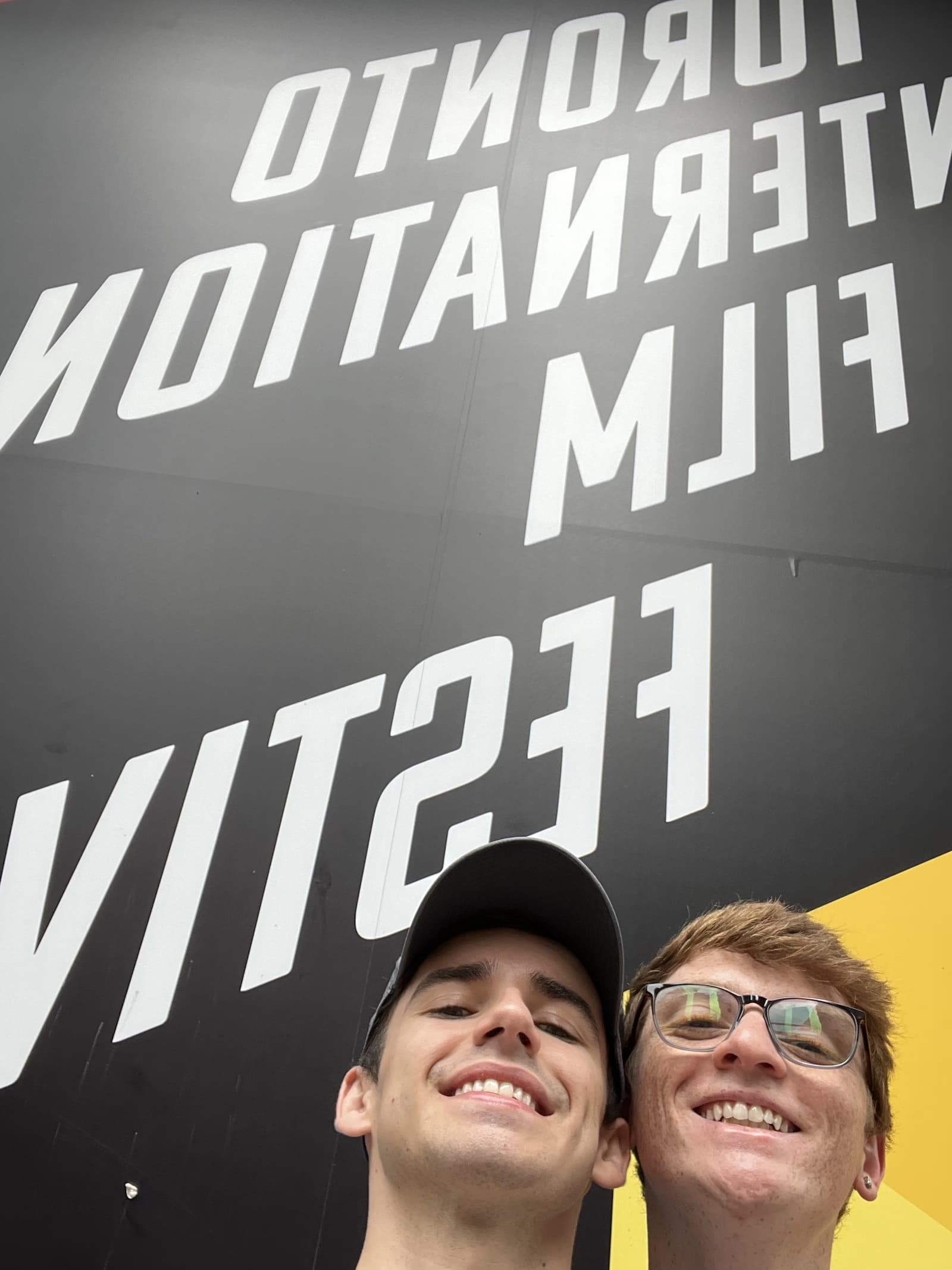 Cheesin' in front of the big TIFF banner outside the Bell Lighthouse Theater in Toronto